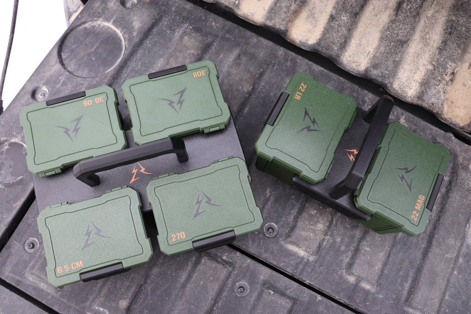East Ridge Ammo boxes on a tailgate inside the 2 and 4 box carriers