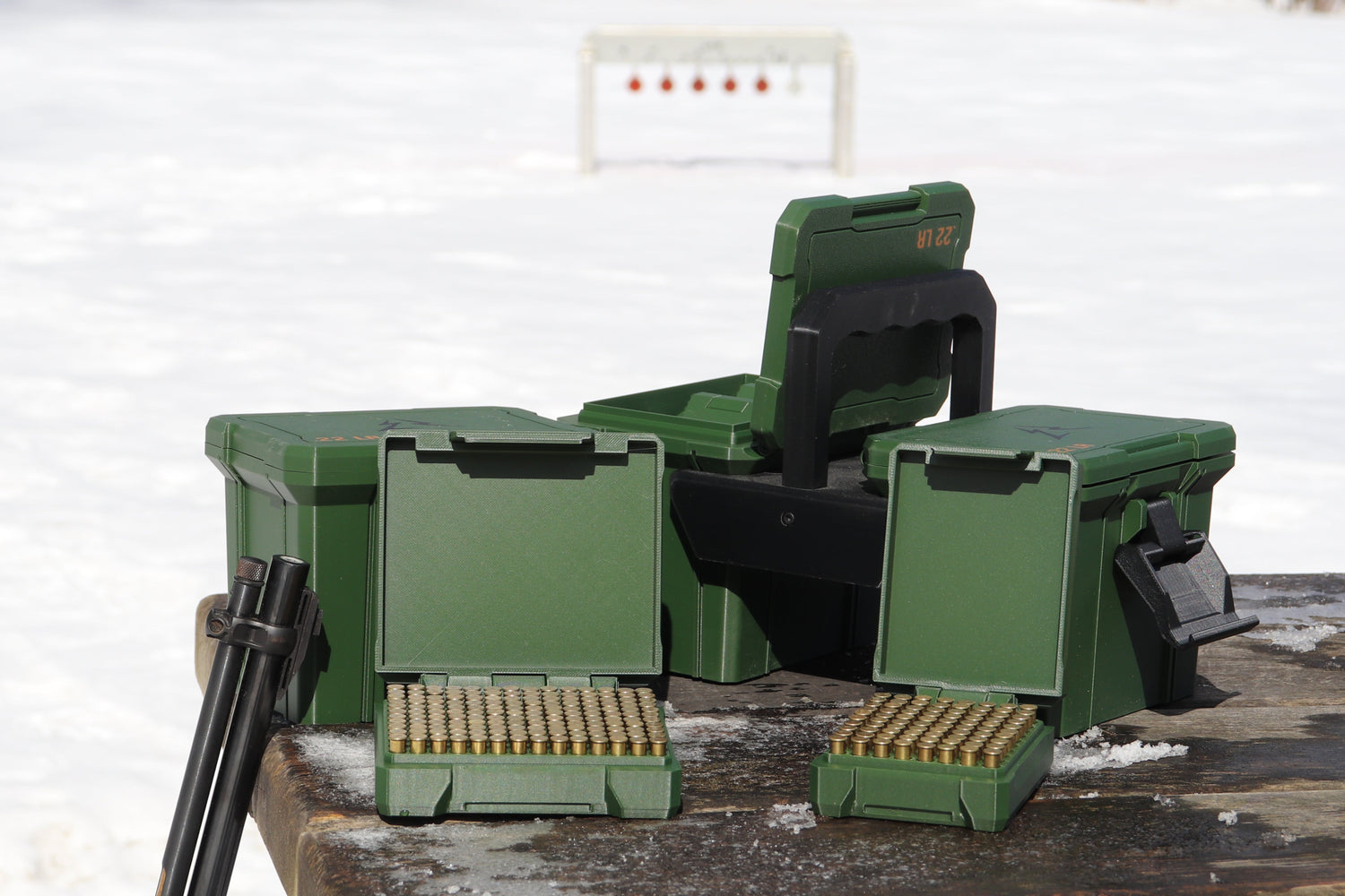 East Ridge 22 LR ammo cases with a rifle and steel target
